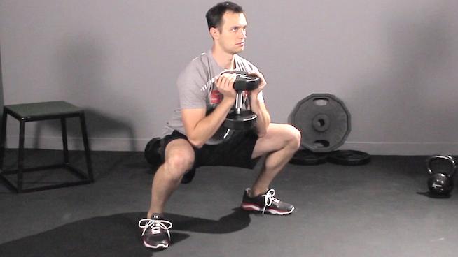 Приседание с гантелей у груди