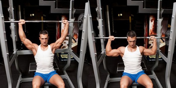 жим сидя в тренажере на плечи